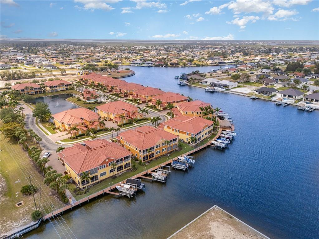 Birds eye view of property featuring a residential view and a water view