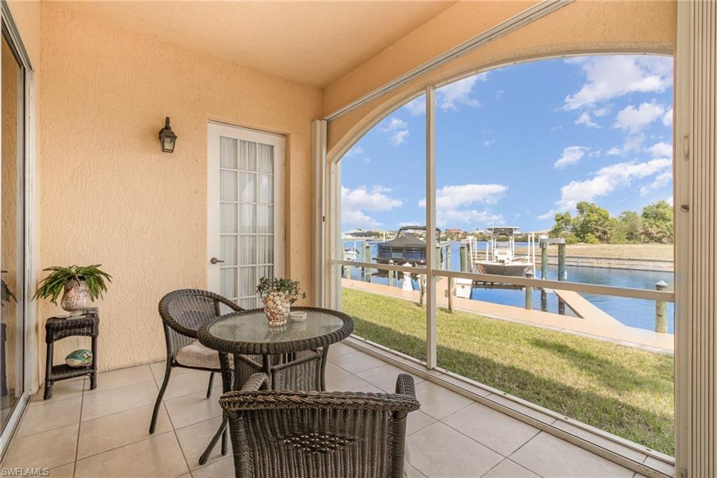 Sunroom / solarium with a water view