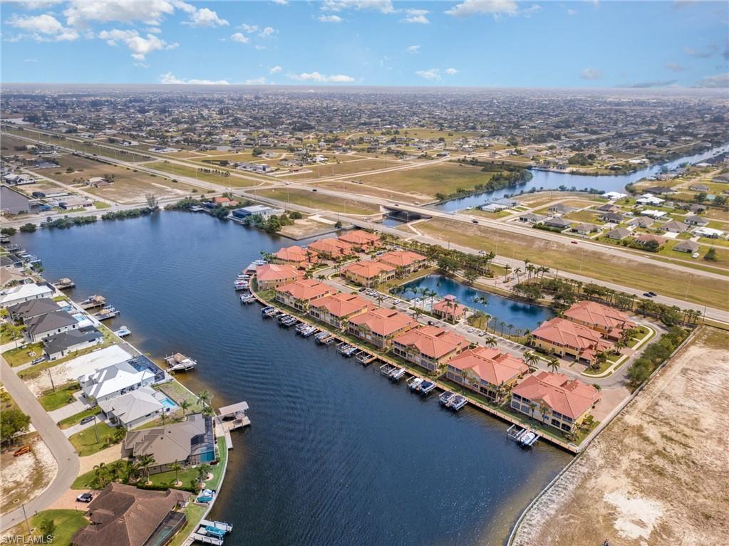 Aerial view with a water view and a residential view