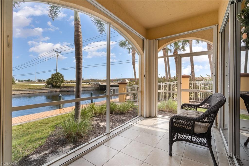 Sunroom / solarium featuring a healthy amount of sunlight and a water view