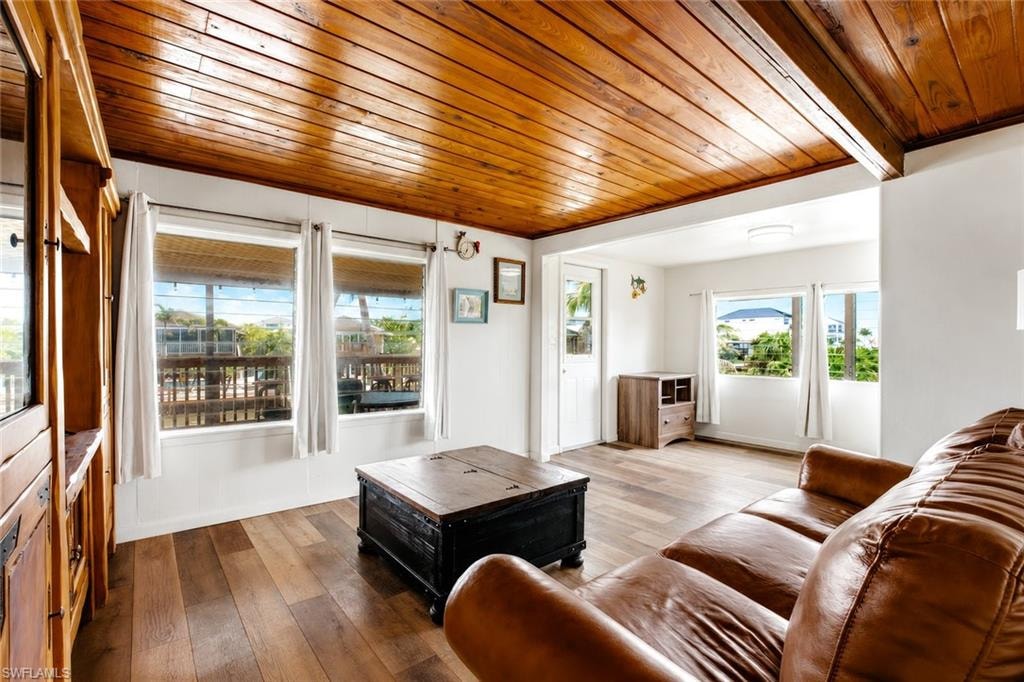 Wood-finish flooring throughout, featuring a wood-paneled ceiling