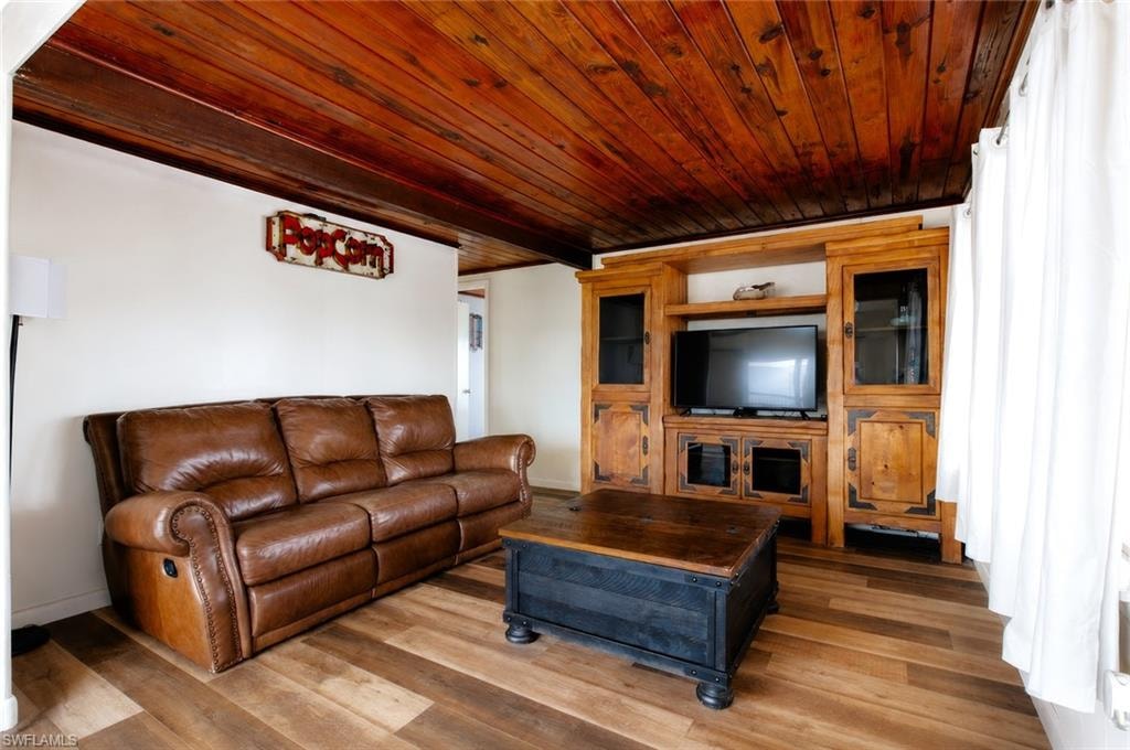Wood-finish flooring with a dark wood plank ceiling