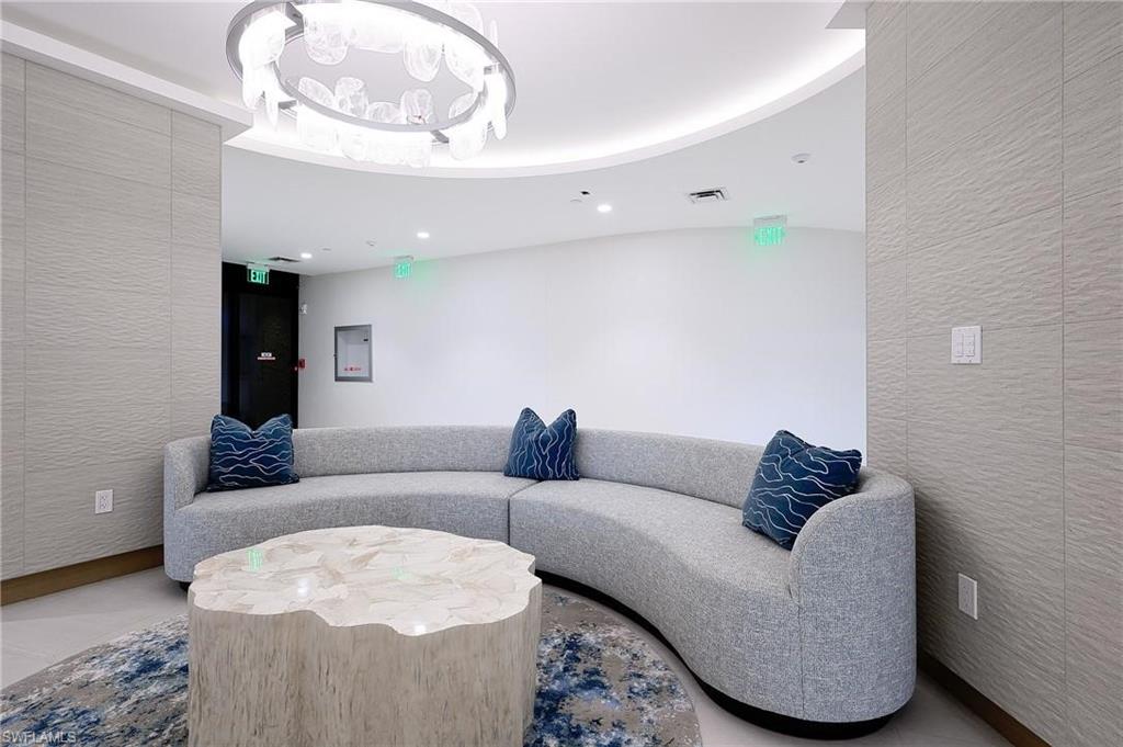 Common area with recessed lighting and a textured wall