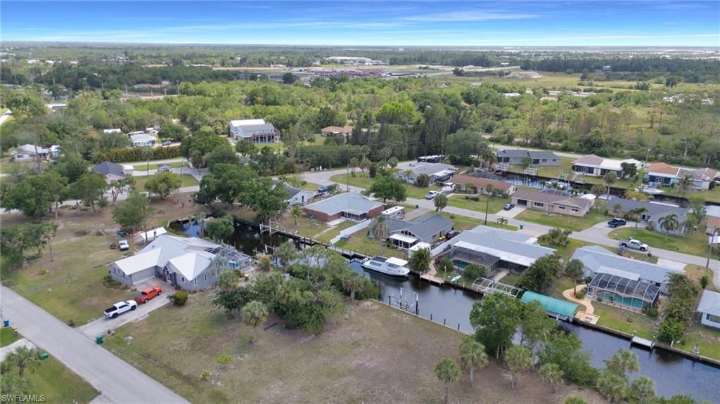 Drone / aerial view with a residential view and a water view