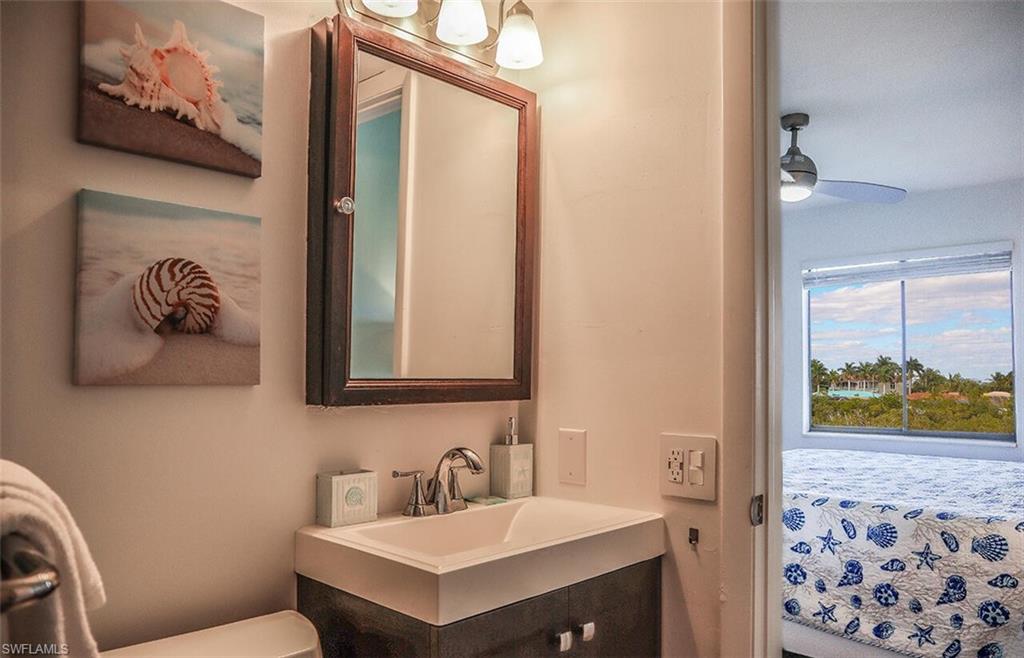 Half bathroom with toilet and vanity