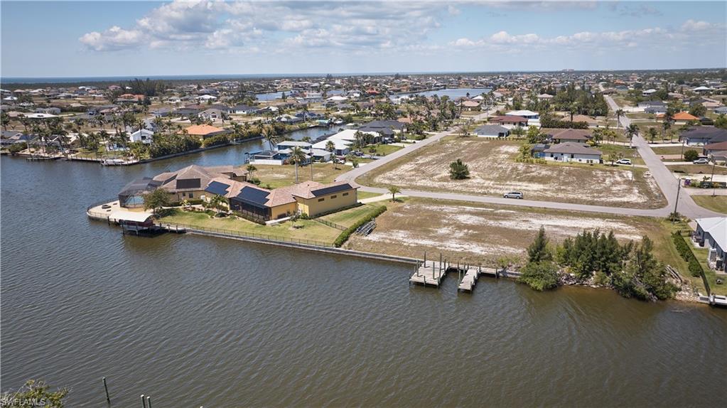 Drone / aerial view featuring a residential view and a water view
