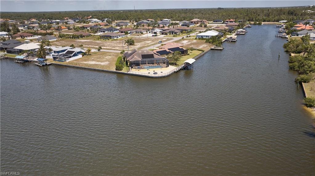 Bird's eye view featuring a water view and a residential view