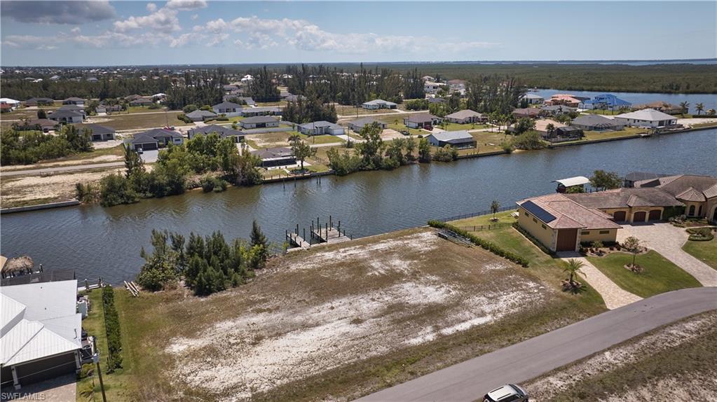 Drone / aerial view featuring a residential view and a water view