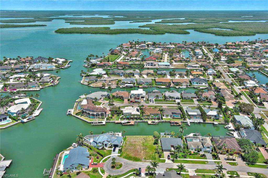 Aerial view with a residential view and a water view