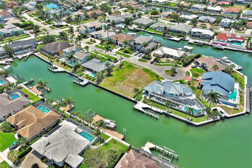 Birds eye view of property featuring a residential view and a water view