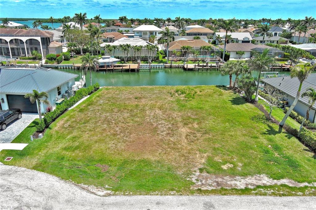 Aerial view featuring a residential view and a water view