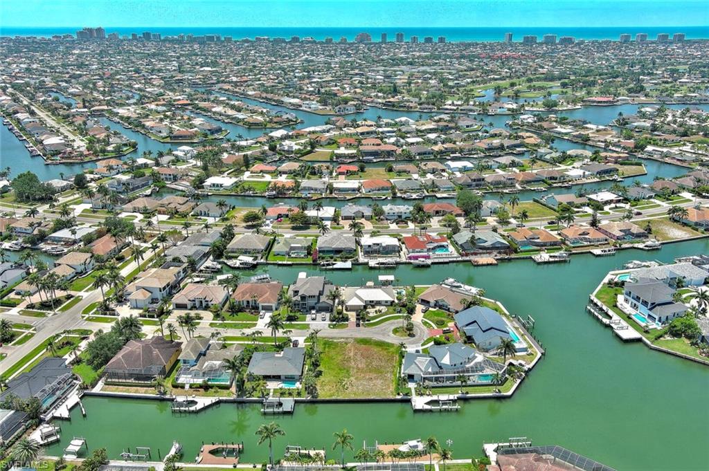 Birds eye view of property featuring a residential view and a water view