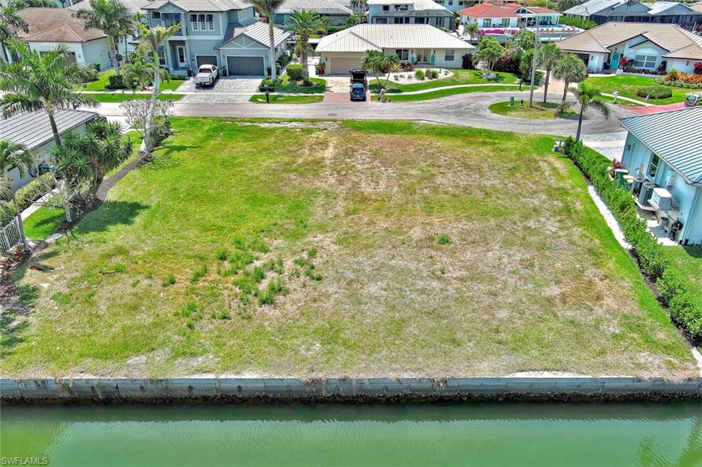Aerial view featuring a residential view and a water view
