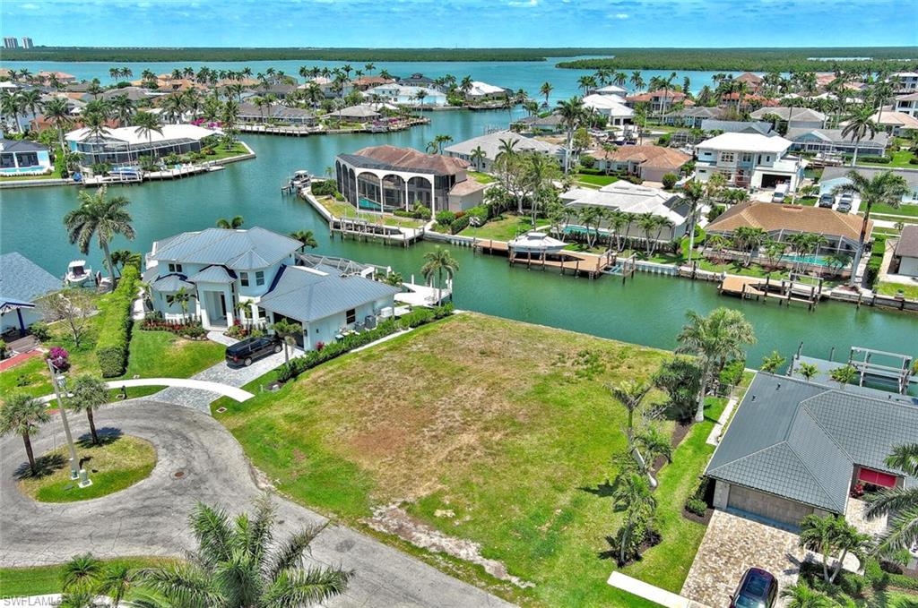 Aerial view featuring a water view and a residential view