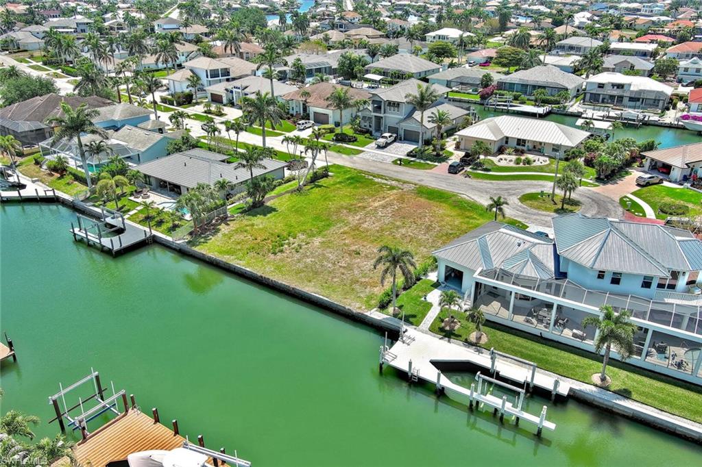 Drone / aerial view featuring a residential view and a water view