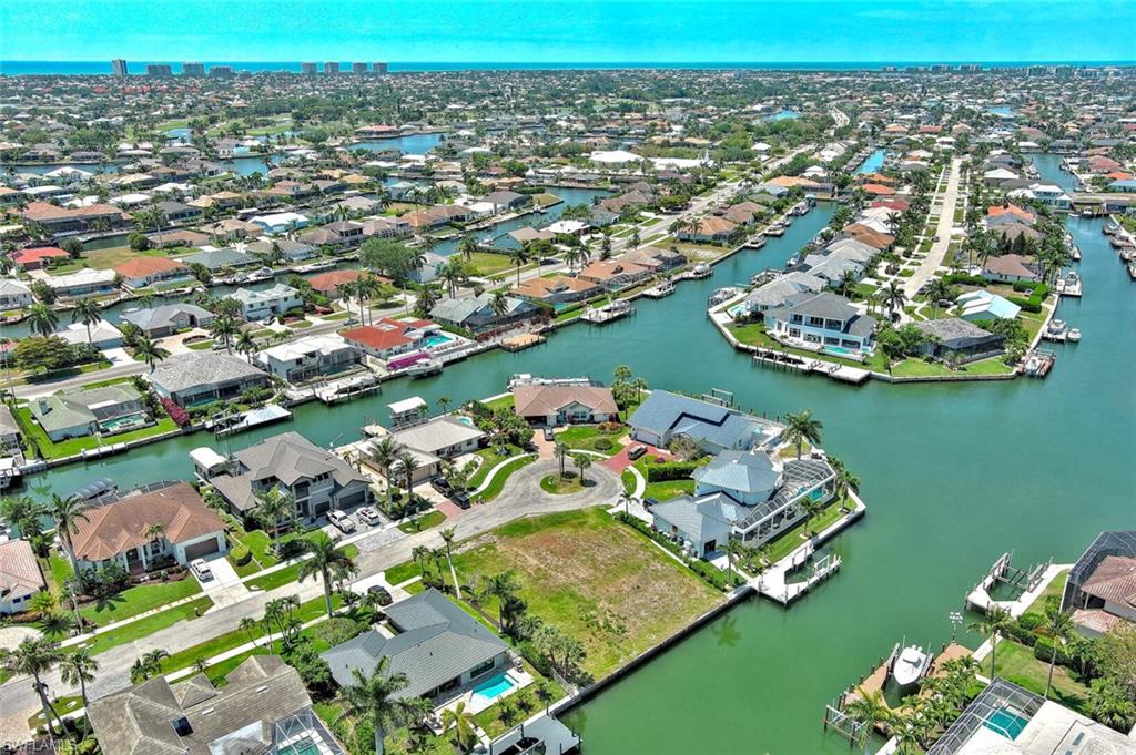 Aerial view with a water view and a residential view