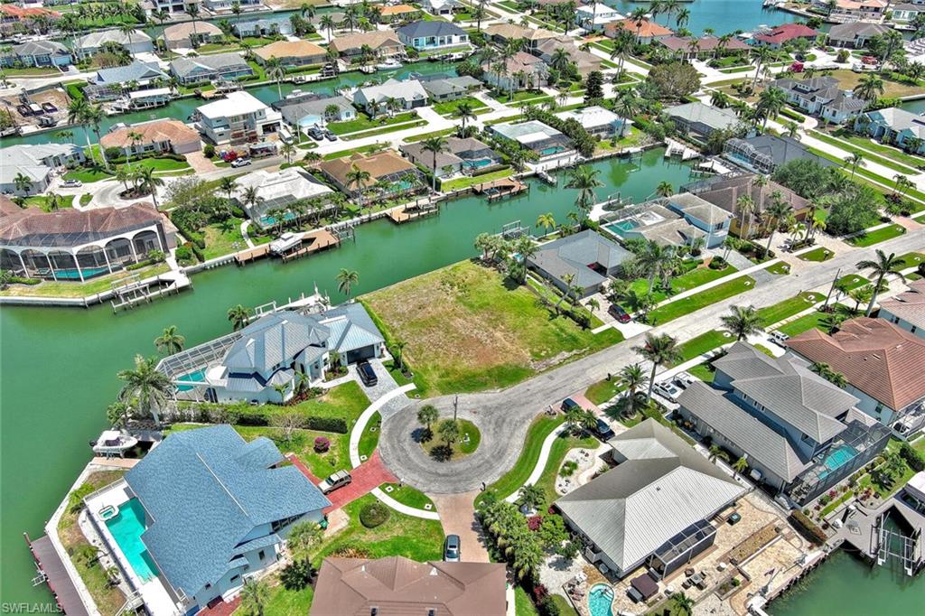 Aerial view with a residential view and a water view