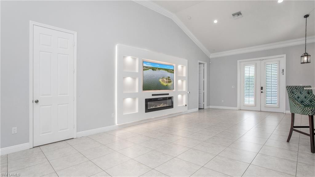 Unfurnished living room featuring french doors, a glass covered fireplace, light tile patterned flooring, ornamental molding, and baseboards