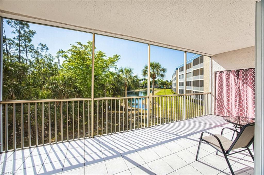 Unfurnished sunroom with a water view