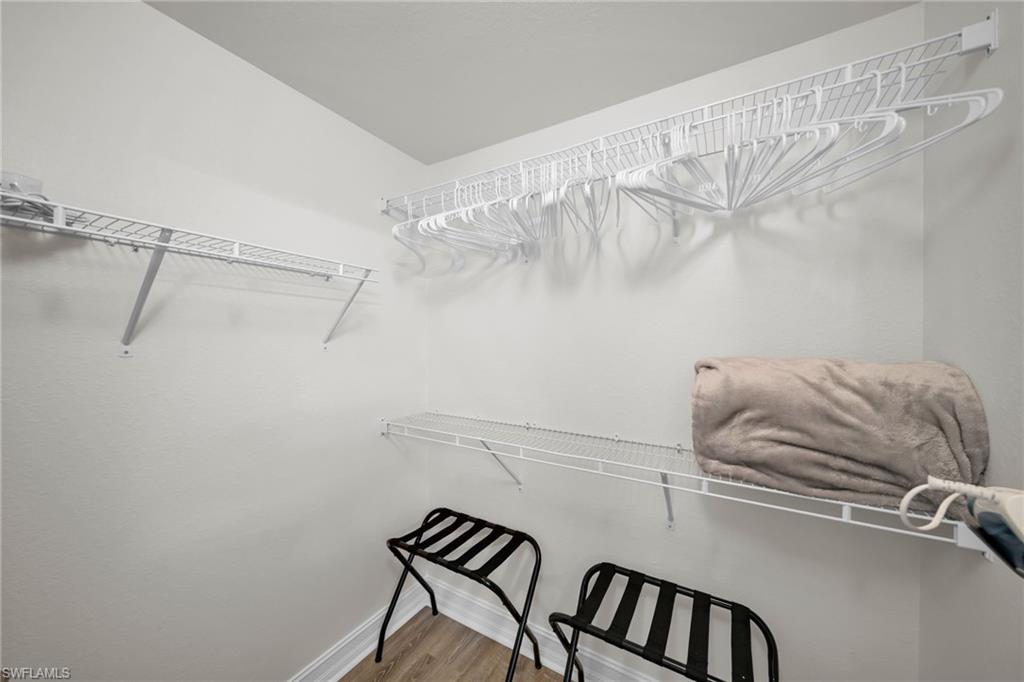 Walk in closet featuring wood finished floors