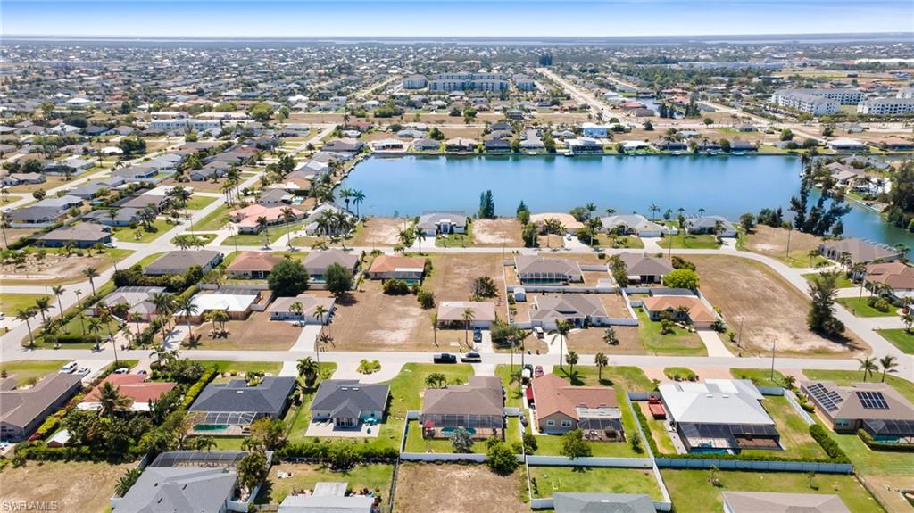Aerial view with a residential view and a water view