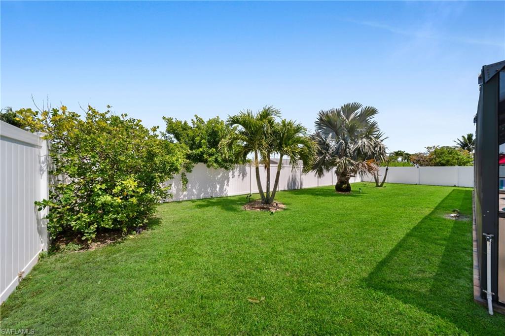 View of yard featuring a fenced backyard