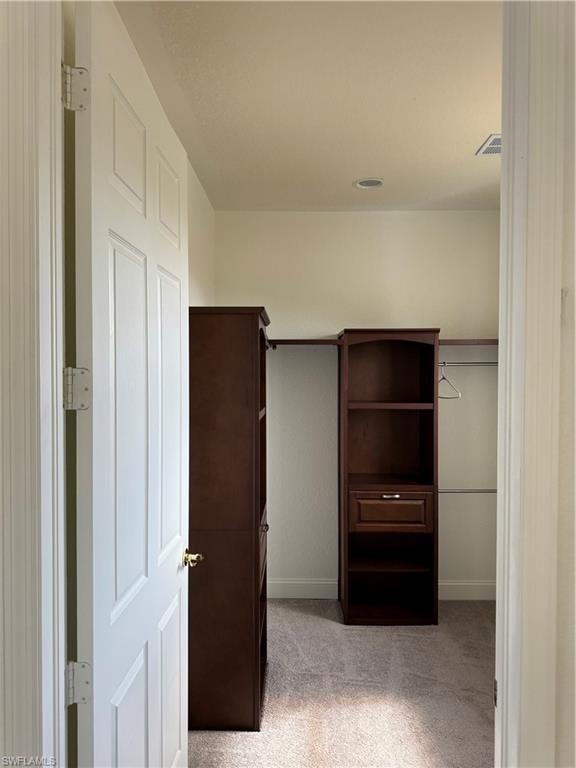 Foyer with tile patterned floors, french doors, baseboards, a notable chandelier, and a high ceiling