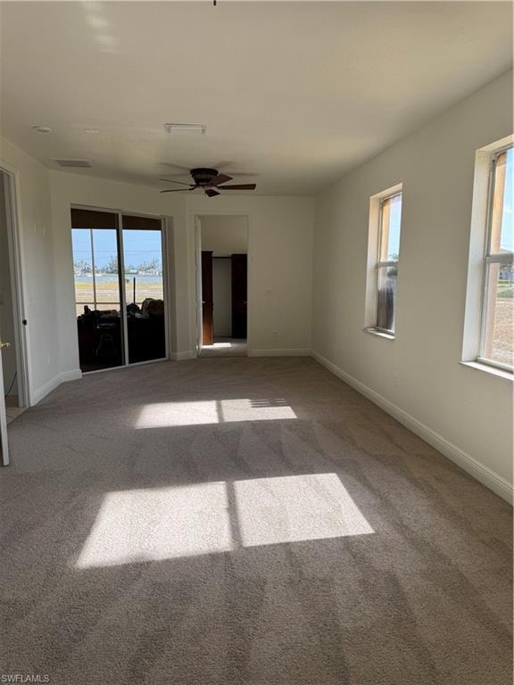Entrance foyer with high vaulted ceiling, arched walkways, a ceiling fan, light tile patterned flooring, and baseboards