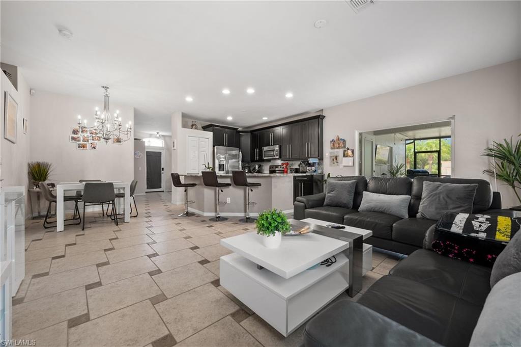 Living room with a chandelier and recessed lighting