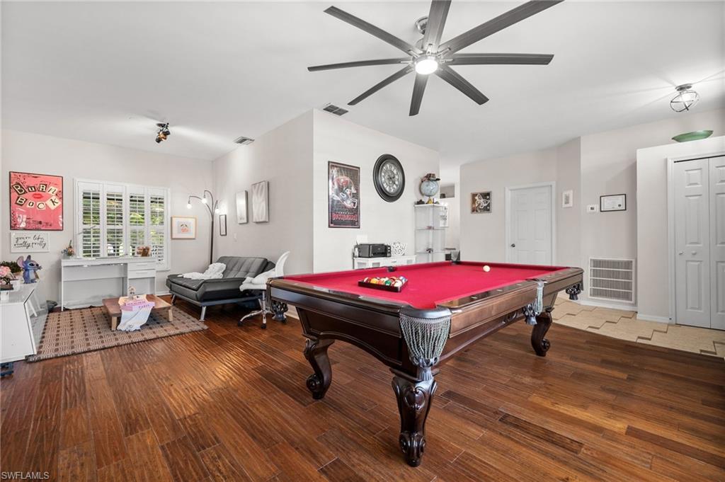 Rec room featuring a ceiling fan, billiards table, and wood finished floors