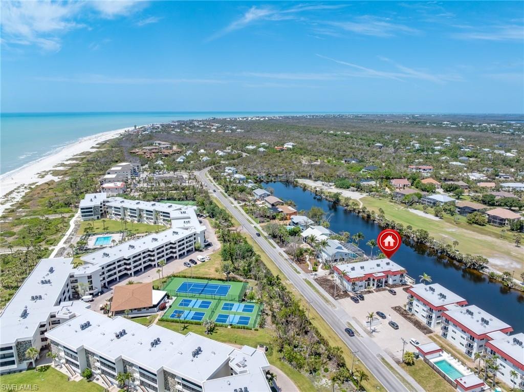 Birds eye view of property featuring a water view