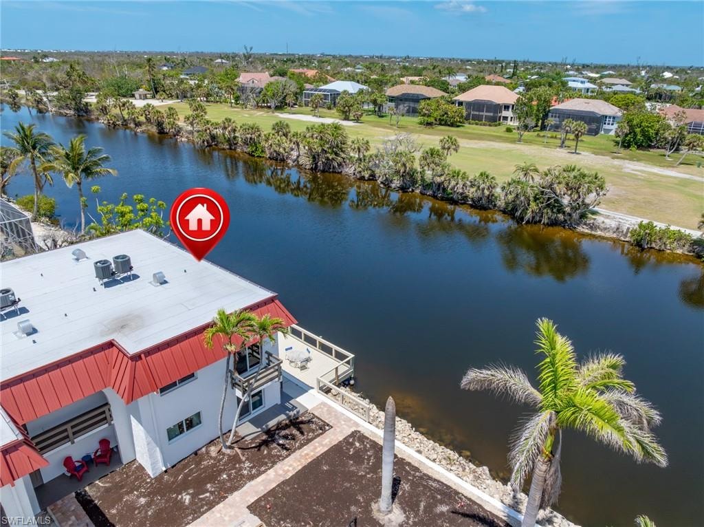 Bird's eye view with a water view and a residential view