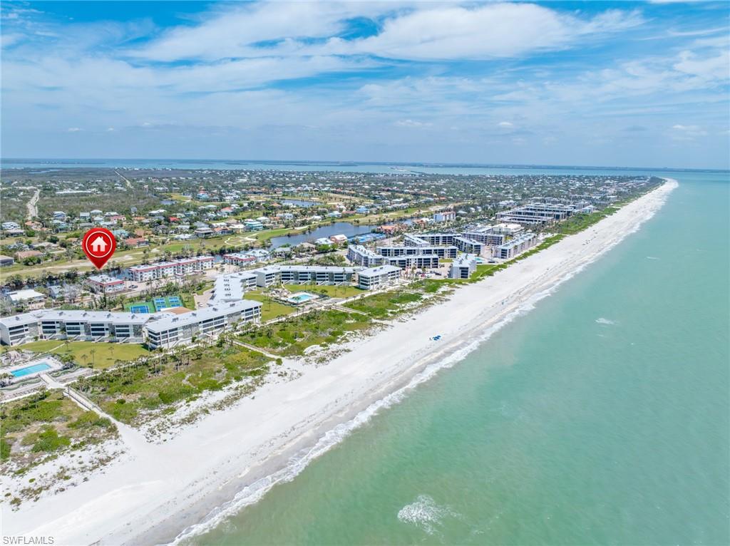 Bird's eye view featuring a view of the beach and a water view