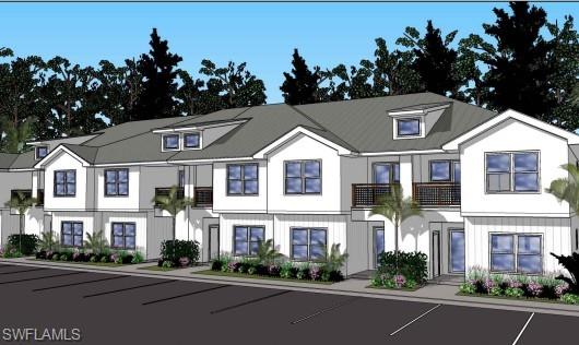 View of front facade featuring uncovered parking