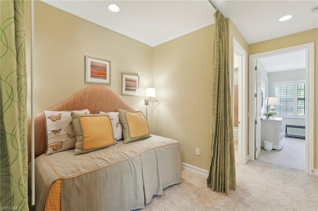 Carpeted bedroom with baseboards and recessed lighting