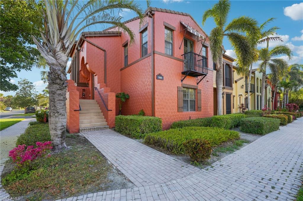 View of property featuring stairs