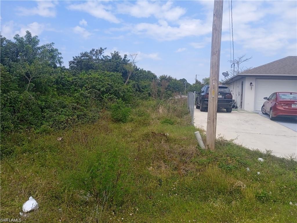 View of road featuring concrete driveway