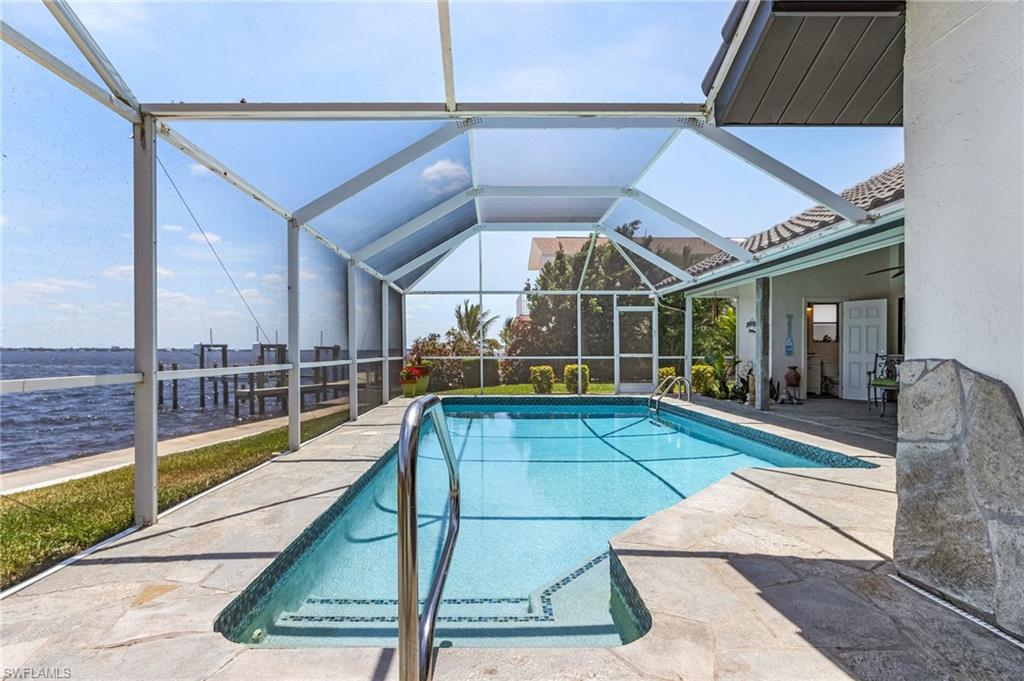 Pool with a patio and glass tile trim...shallow end 3 ft , deep end 8 ft a real SWIMMING POOL....not a wading pool
