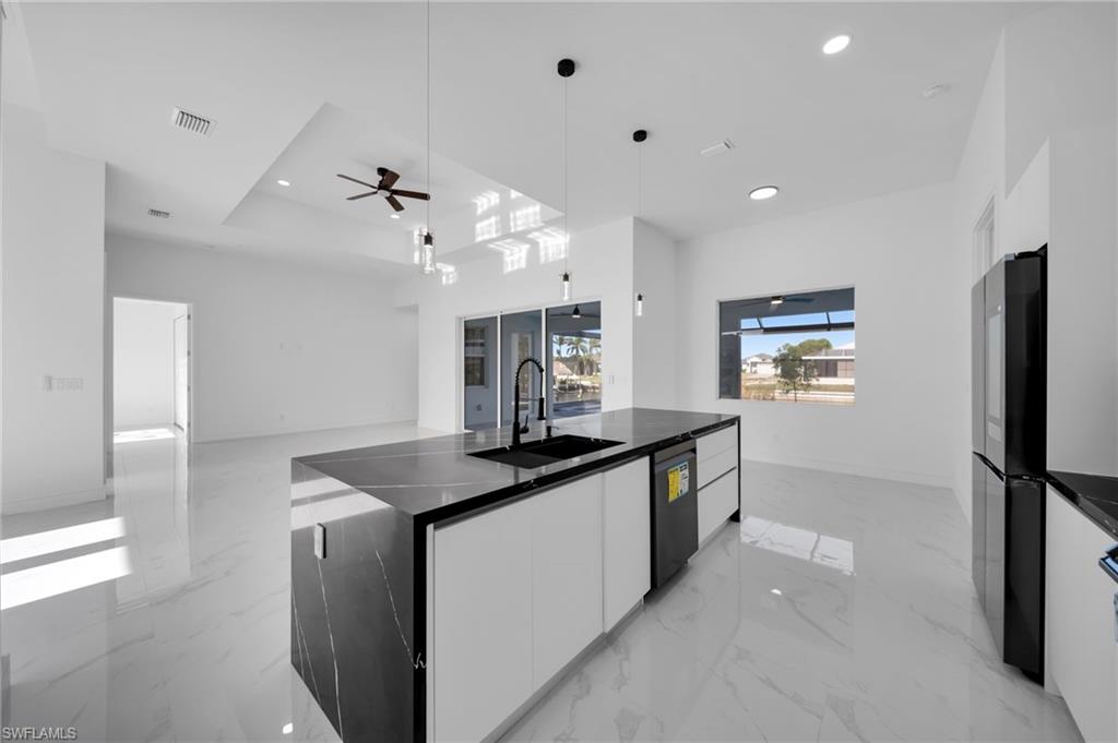 Bar with a sink and baseboards