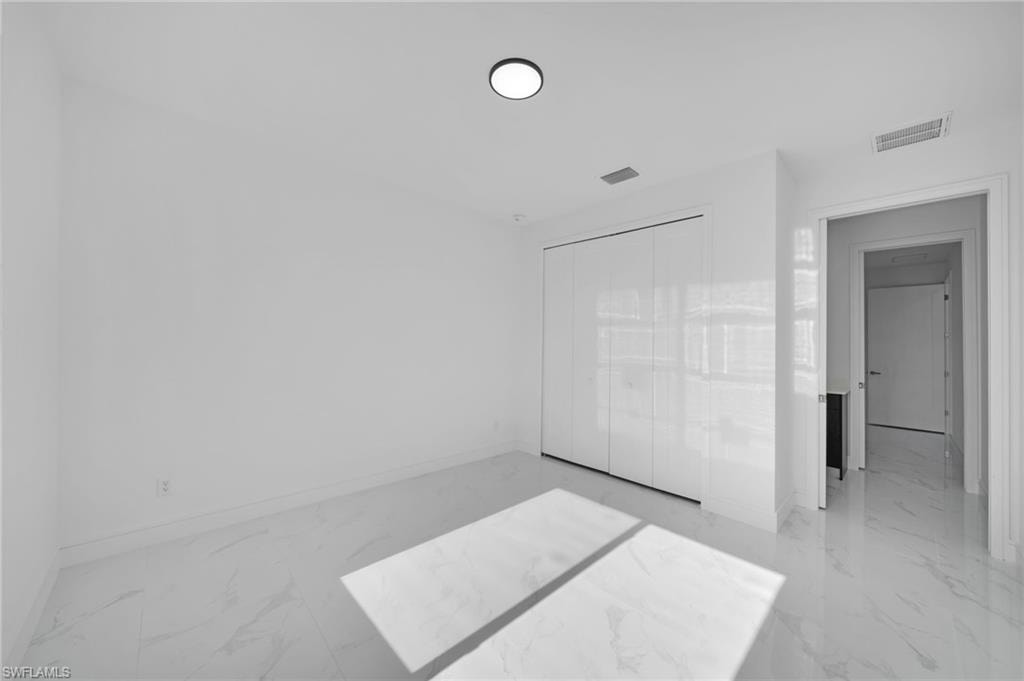 Full bathroom with visible vents, shower / washtub combination, vanity, toilet, and marble finish floor