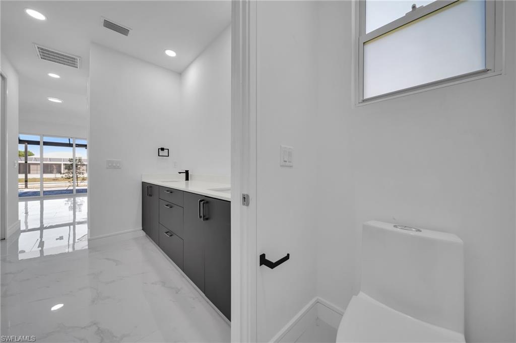 Spare room with baseboards and marble finish floor