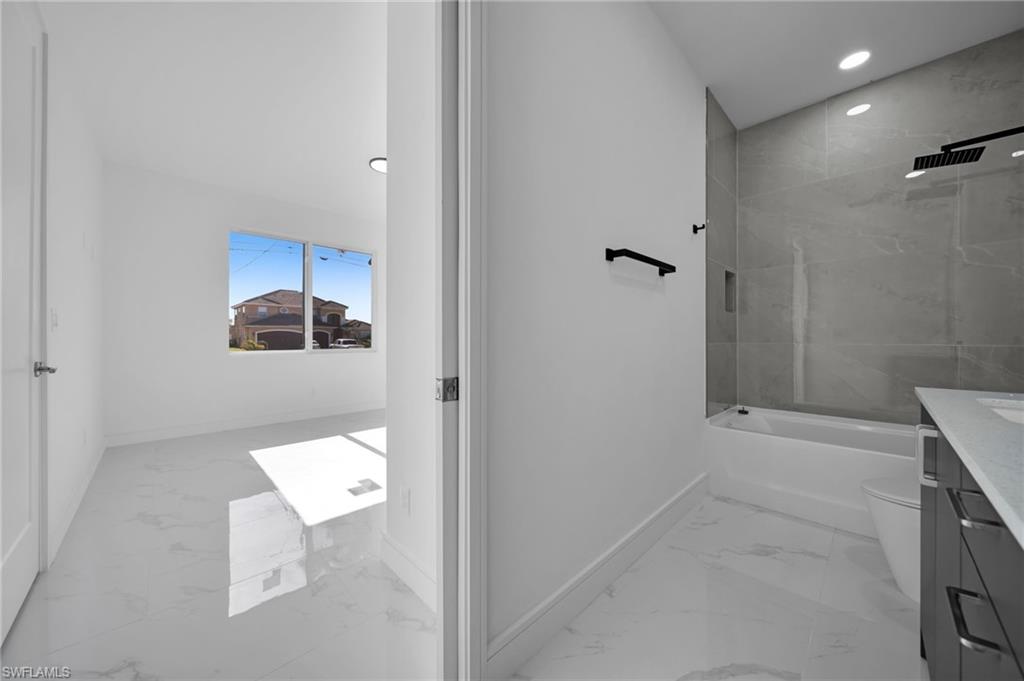 Spare room with baseboards, visible vents, and marble finish floor