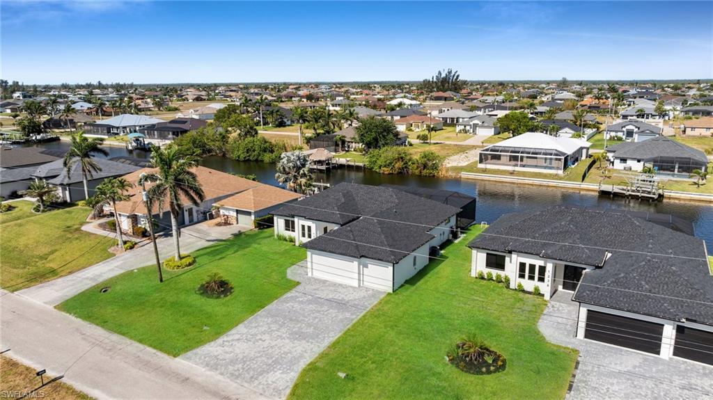 Bird's eye view featuring a water view and a residential view