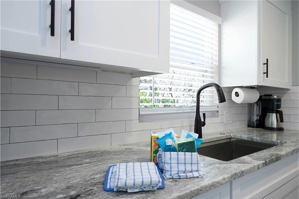 Stylish kitchen showcasing updated fixtures and a contemporary design (Beach home 2) - Virtually Edited Image