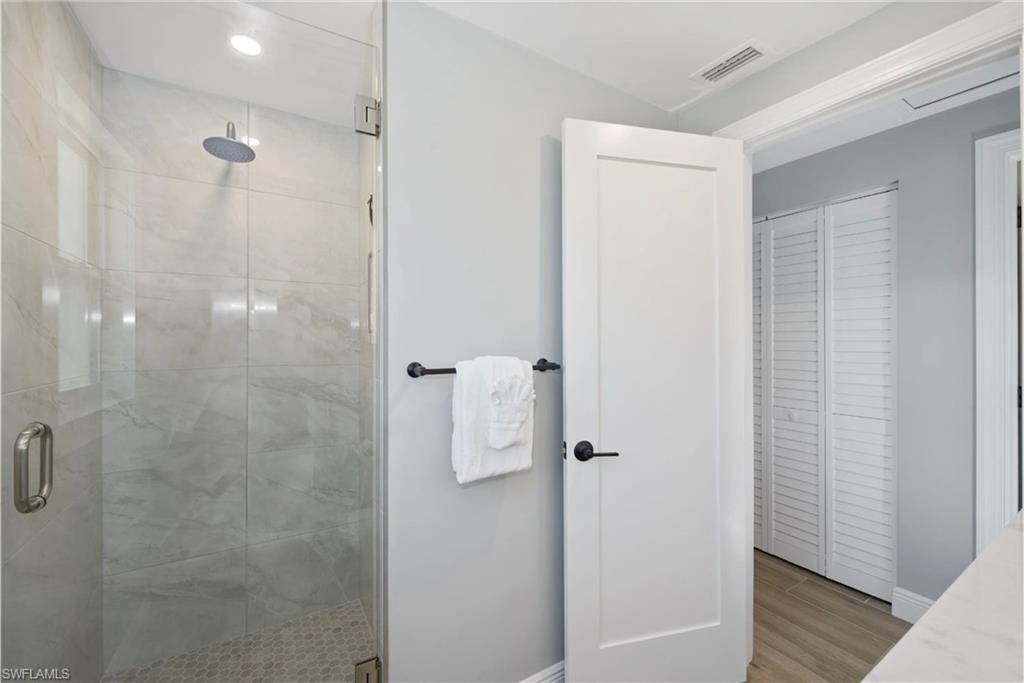 Modern bathroom with a walk-in shower (Beach home 1) - Virtually Edited Image