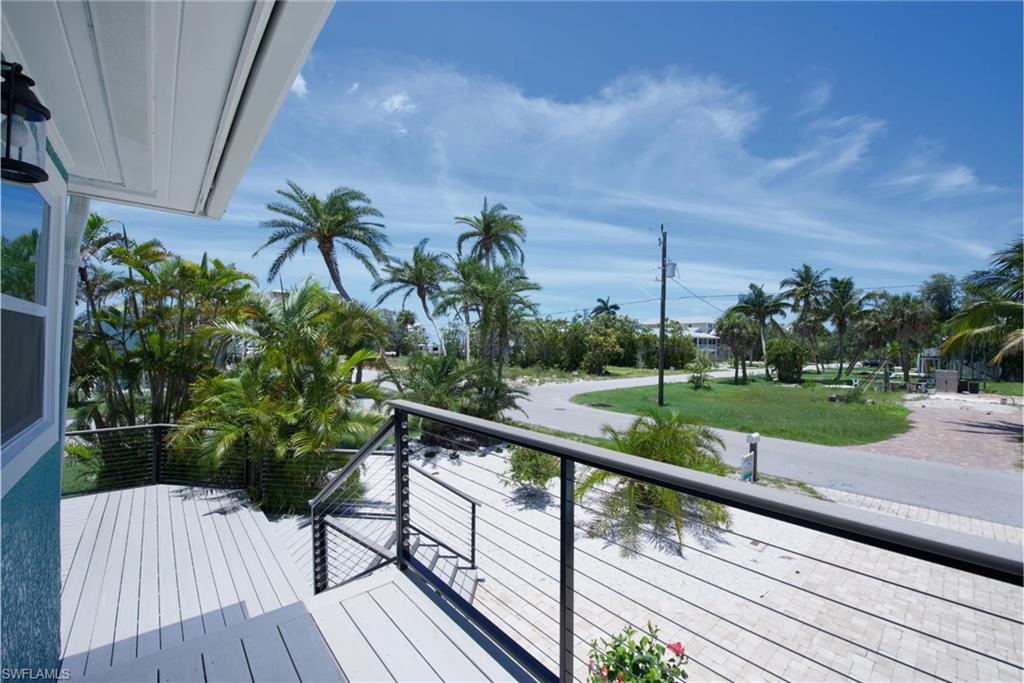 View of outdoor deck, perfect for relaxing and enjoying the surrounding scenery - Virtually Edited Image