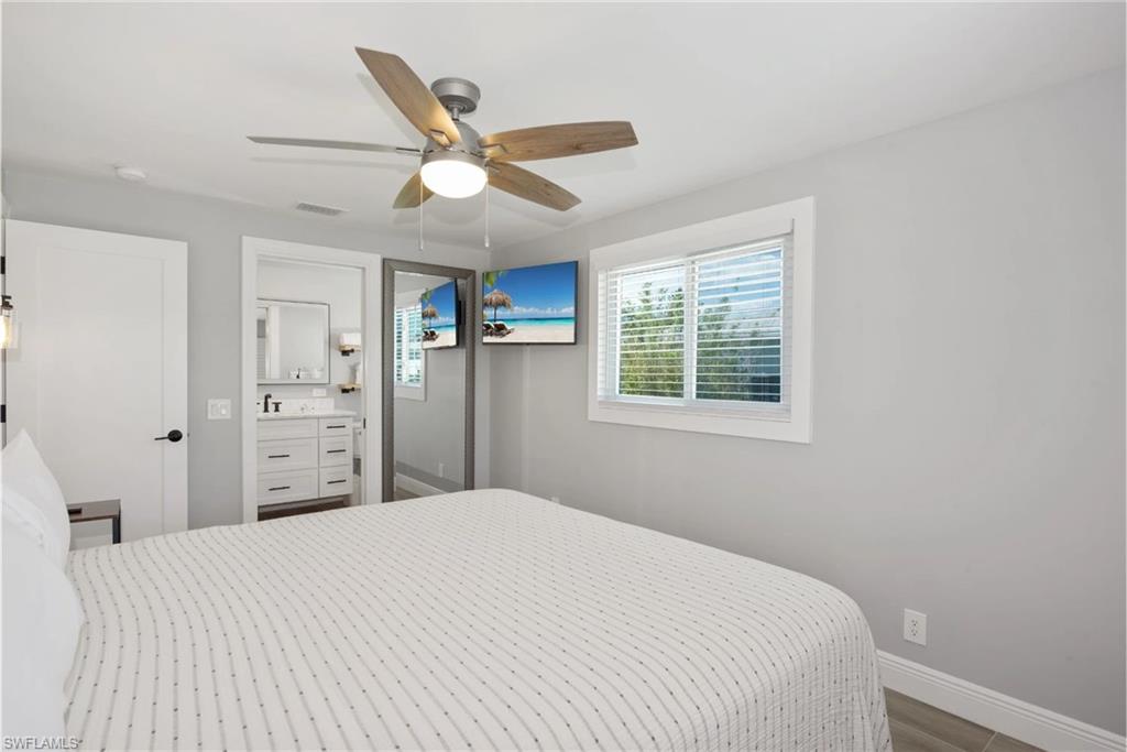Comfortable bedroom with ample closet space  (Beach home 1) - Virtually Edited Image