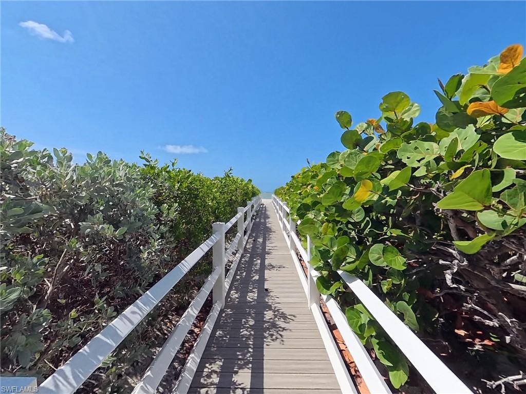 Private boardwalk from rear of building to the beach