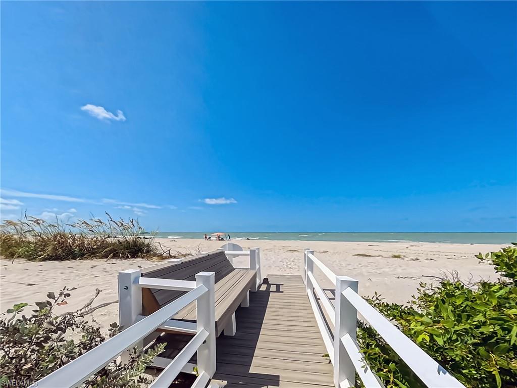 Beach boardwalk with bench