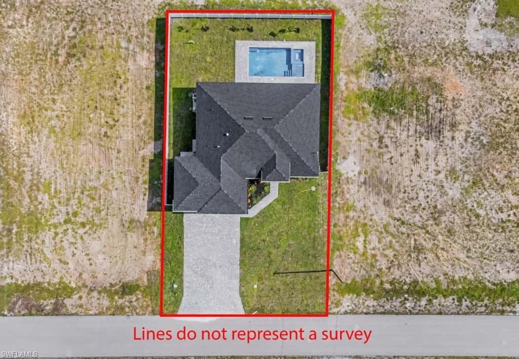 Aerial perspective of suburban area with a nearby body of water